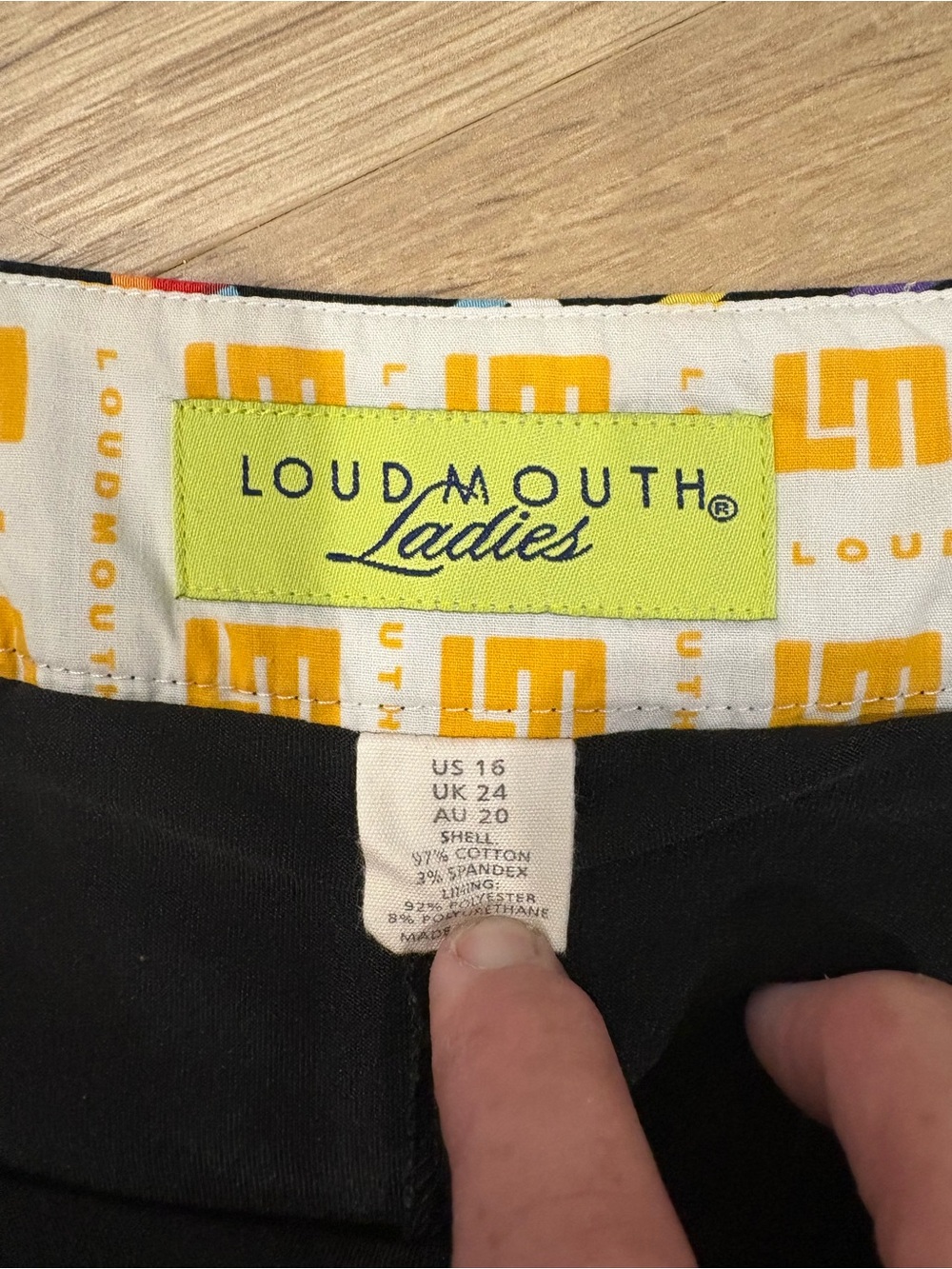 Loudmouth Black Skirt with Neon Multicolor Ribbon Print and Orange Logo